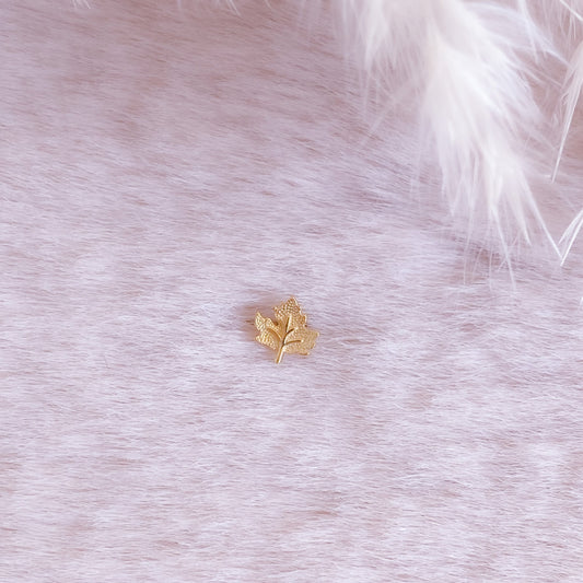 Tiny Maple Leaf Piercing